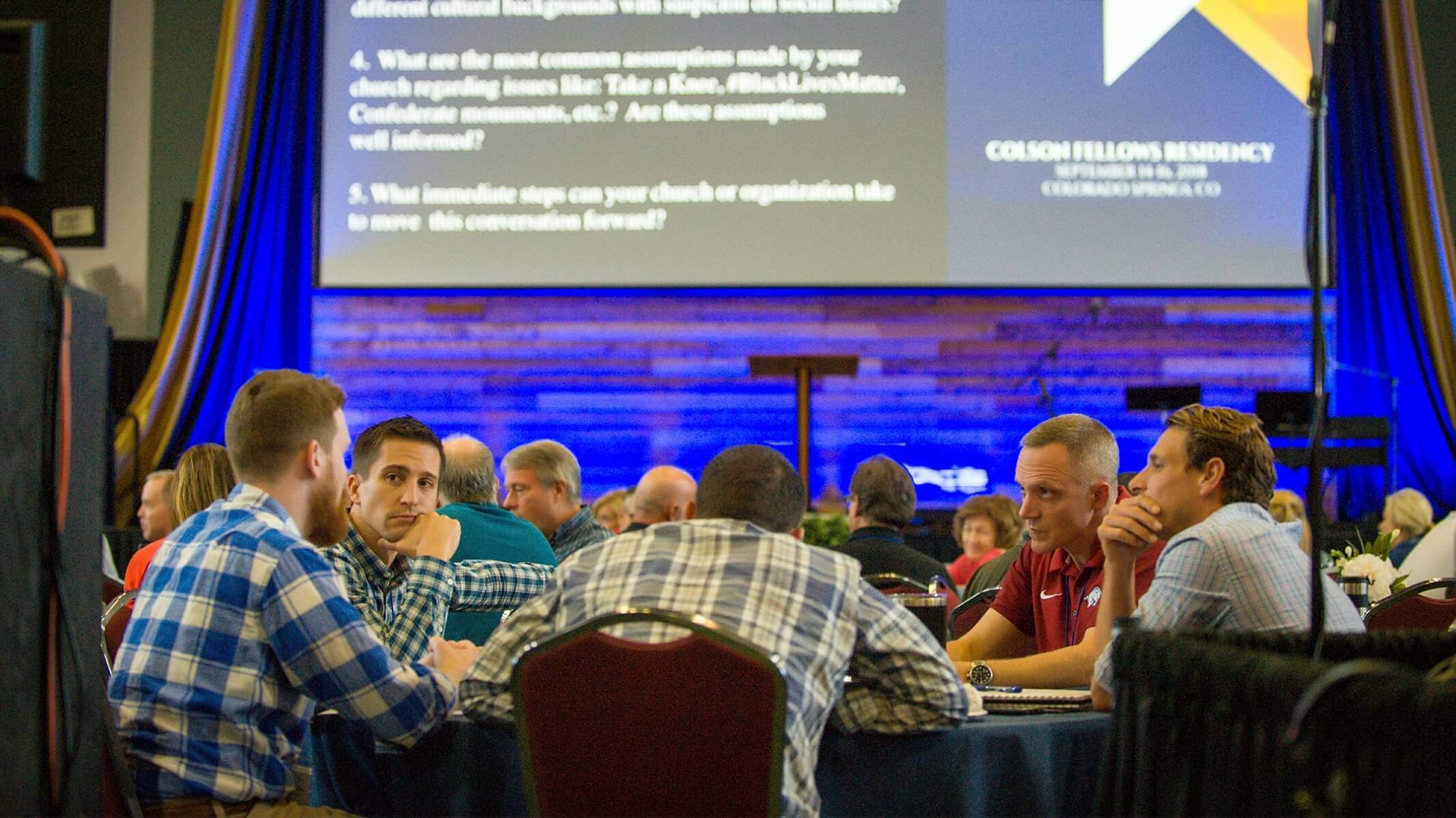 Colson Center groups at tables